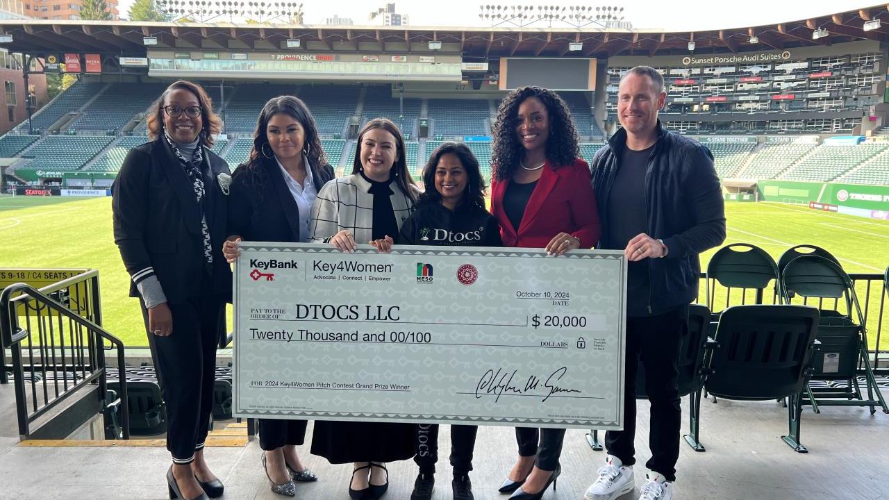 group holding up honorary check
