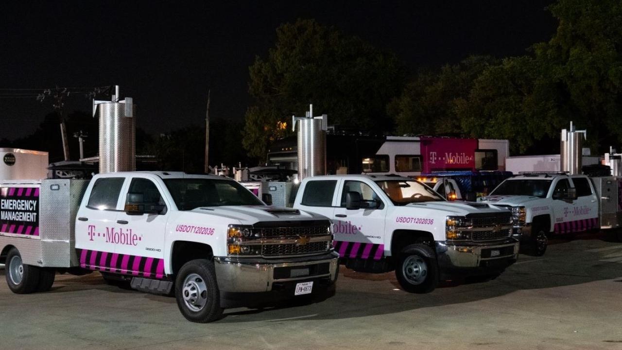 T-Mobile vehicles in parking lot