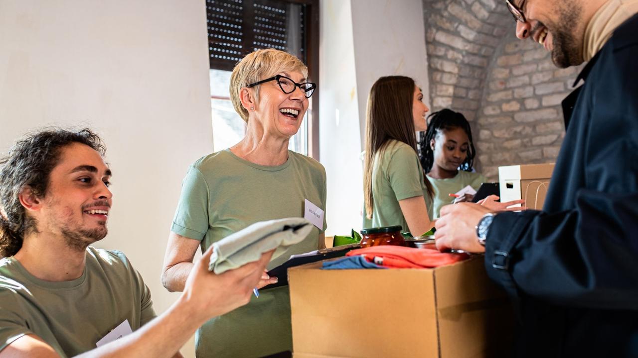 Volunteers help a customer