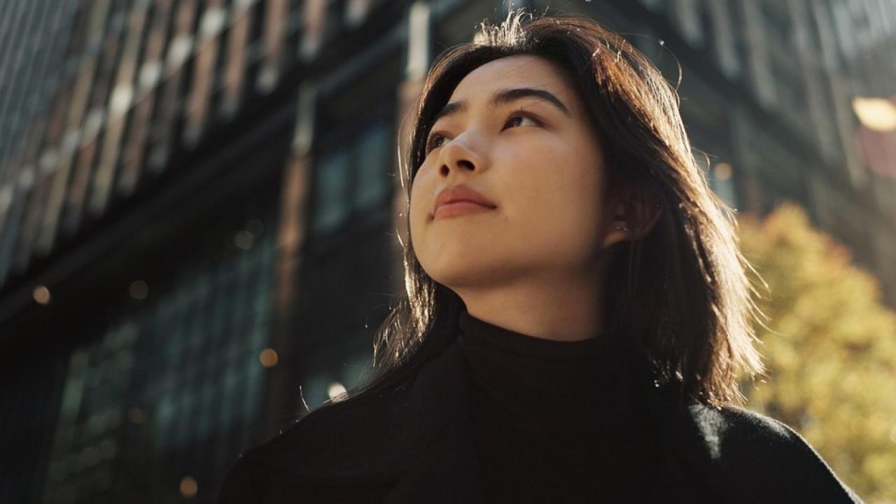 Woman standing outside in a city