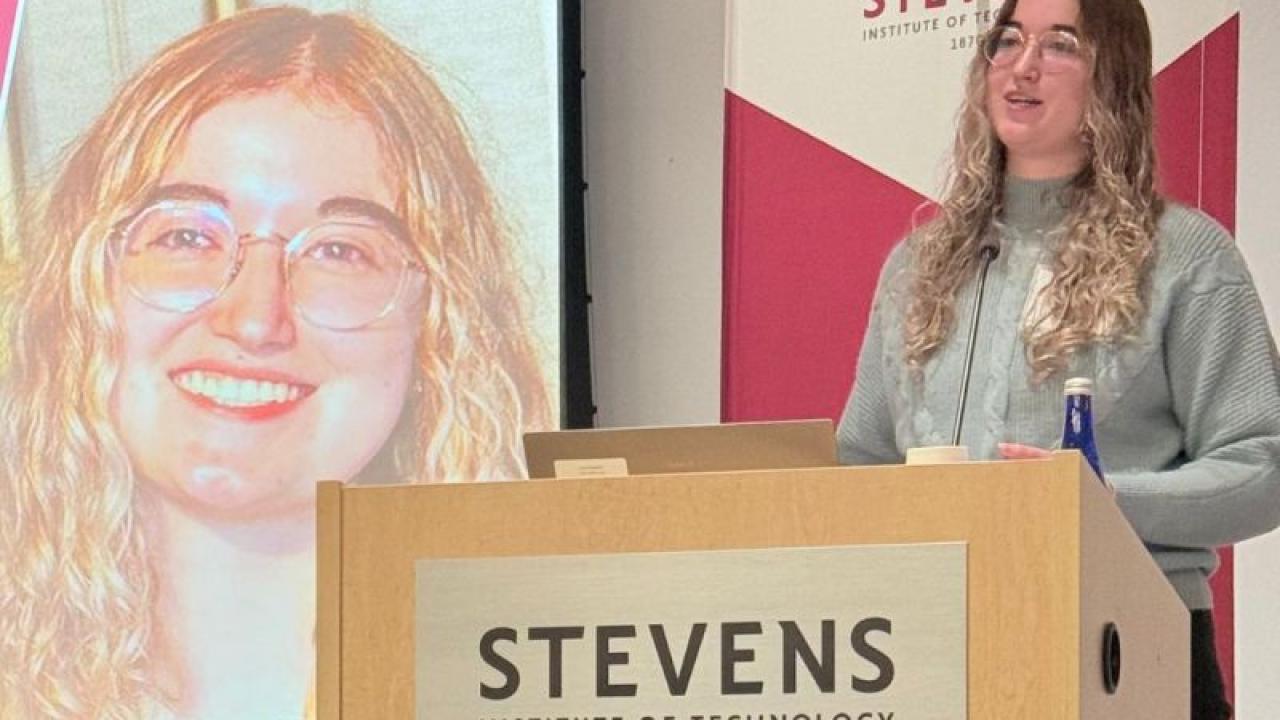 person speaking at a podium