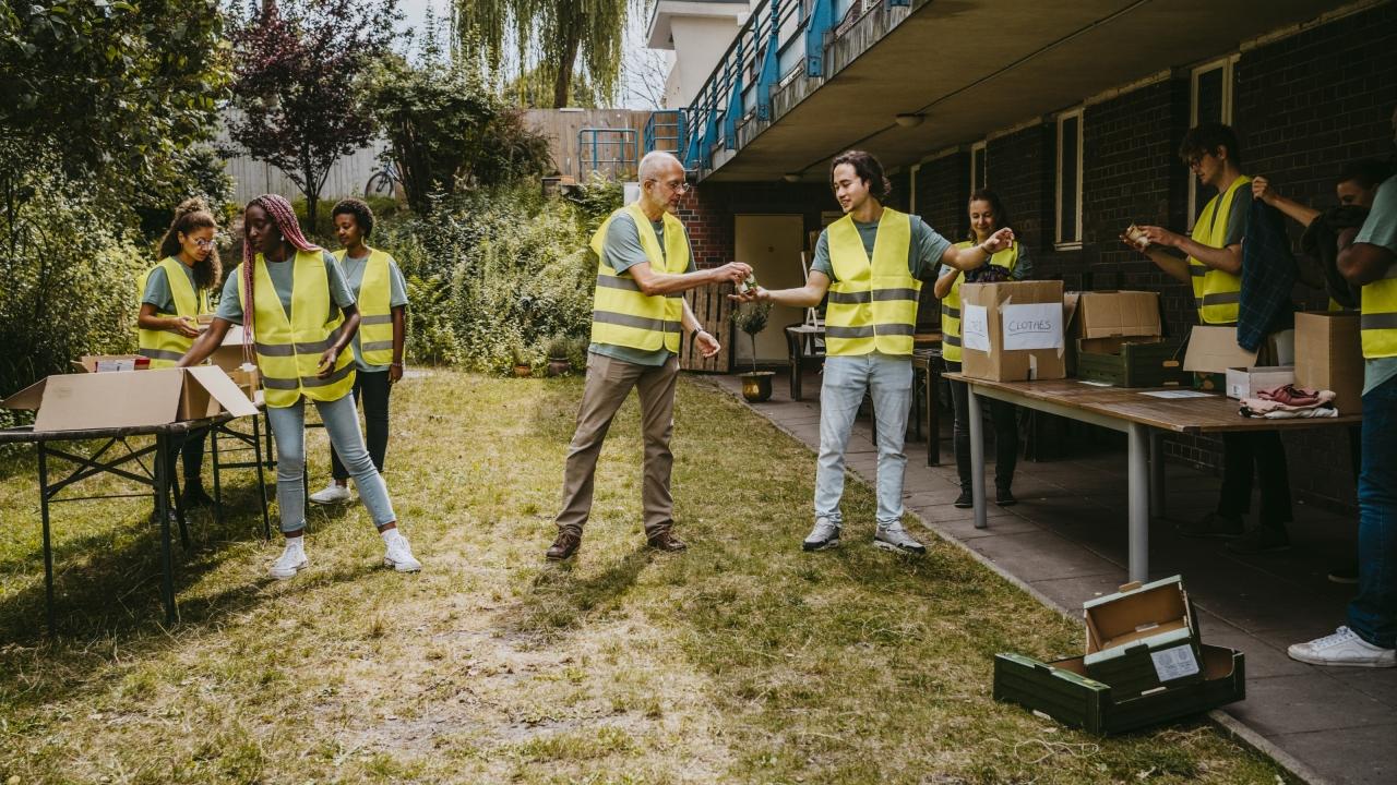 Team in reflective vests working outside at perhaps a tagsale