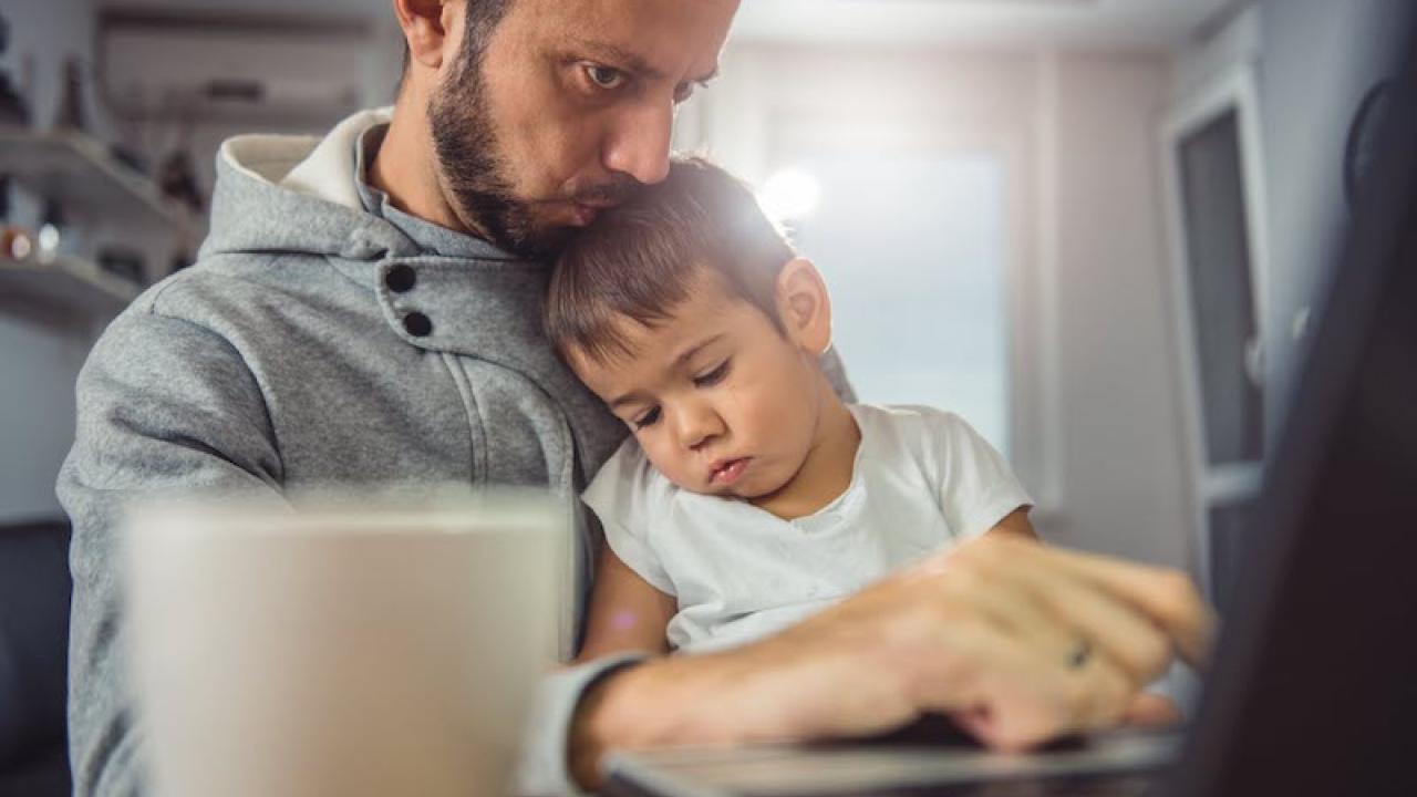 Father holding his son.