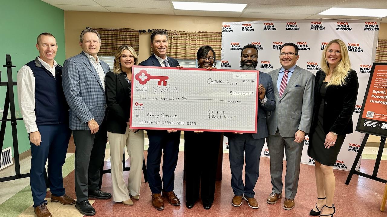 KeyBank leadership and YWCA of Rochester representatives receiving a $200,000. grant check.