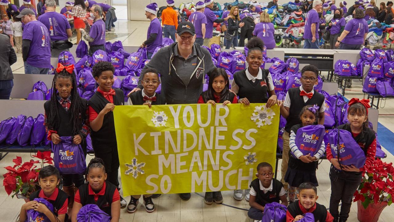 Your Kindness Means so Much sign with group smiling