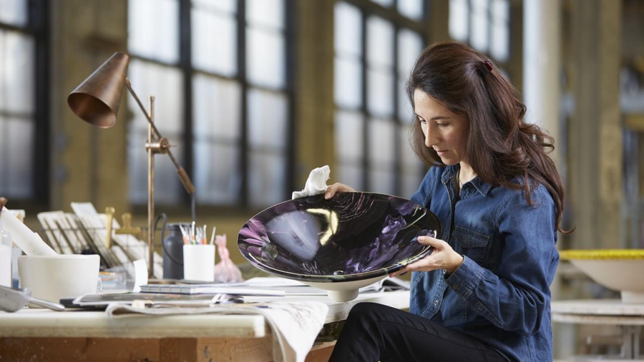 Sitting woman looking at a bowl