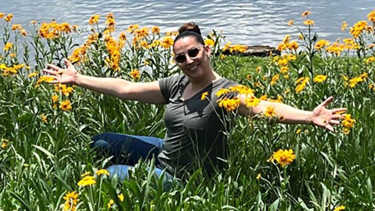 Kandyce Reyna in a field of flowers