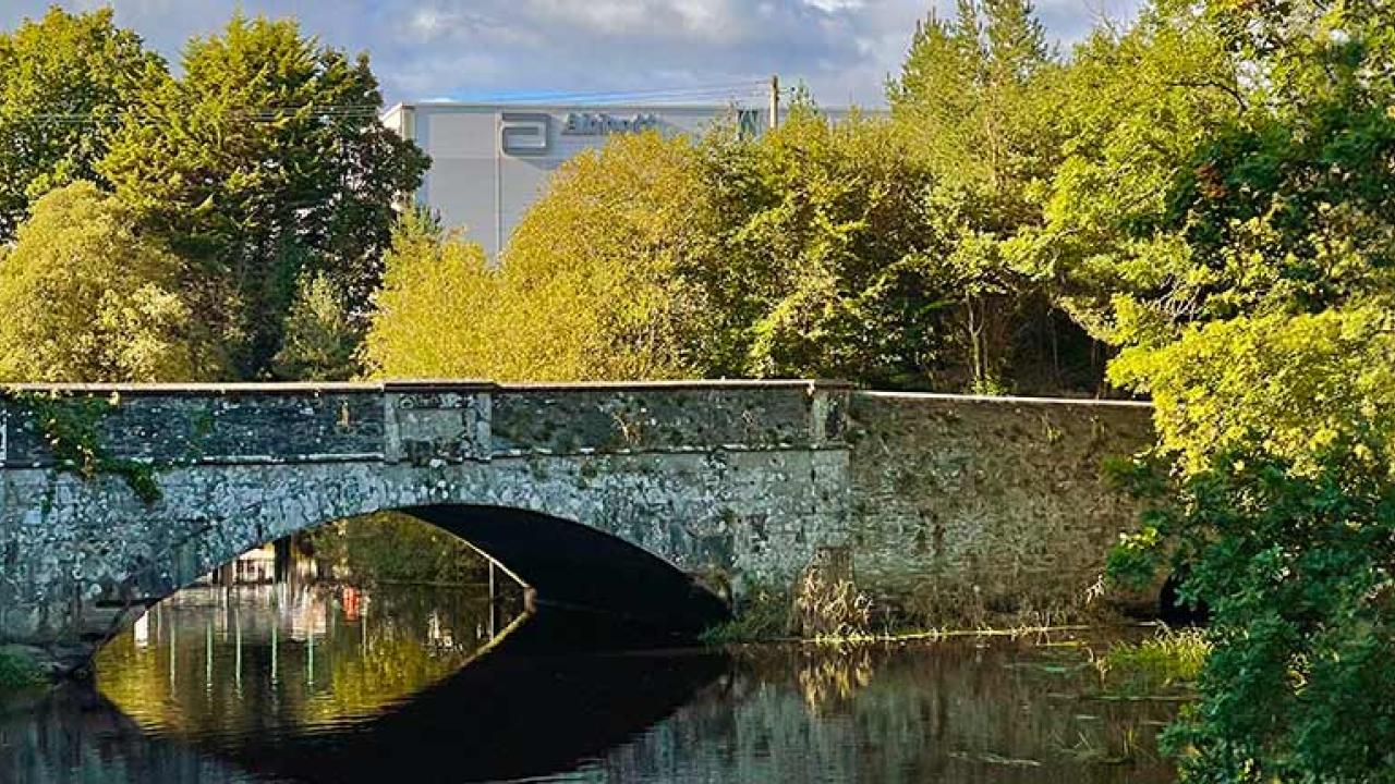 Bridge over water with Abbott building in background