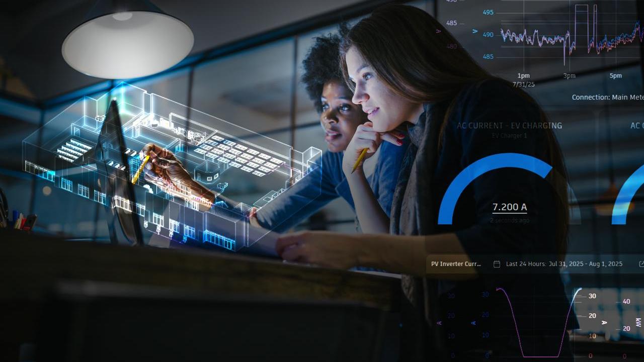 Two people looking at a screen