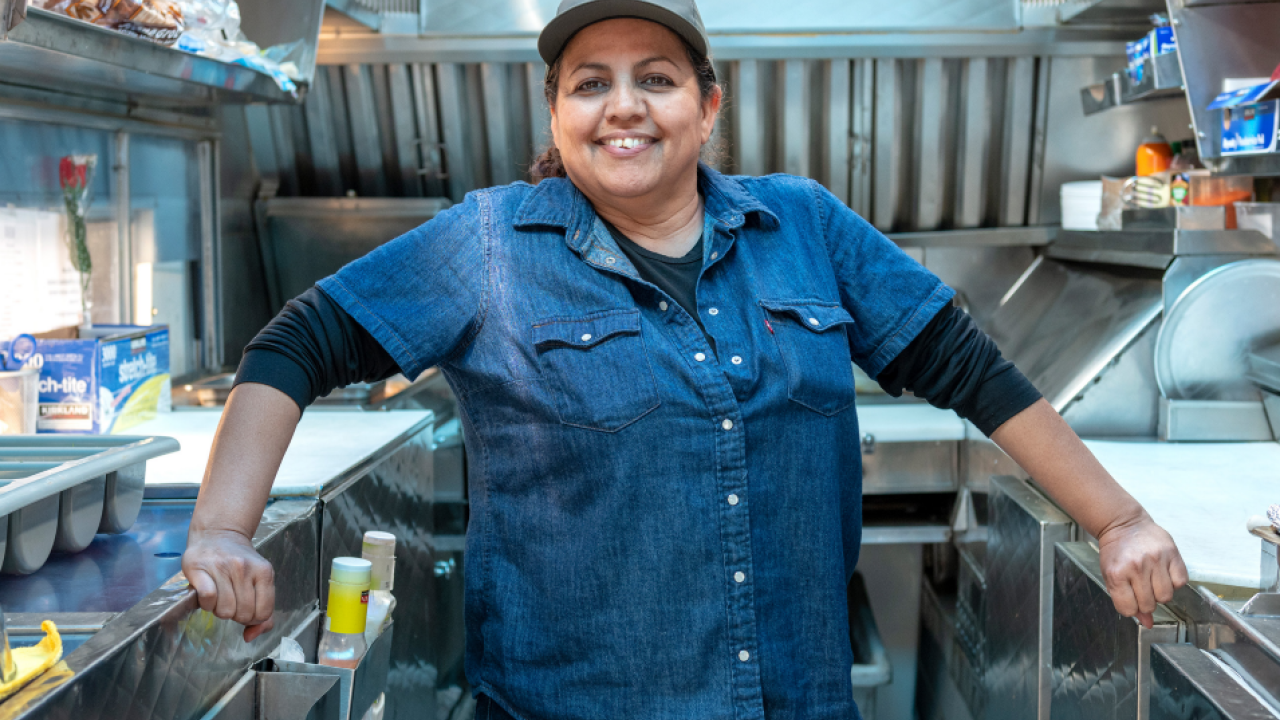 Person standing in a professional kitchen