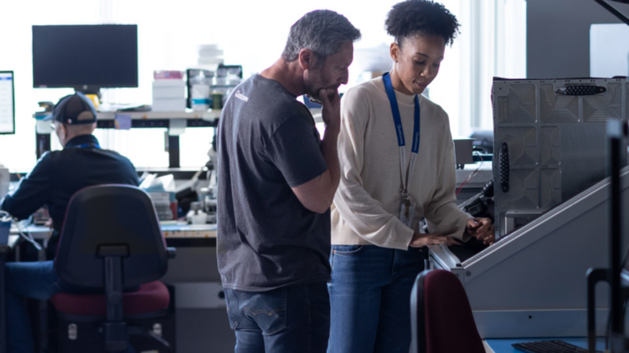 co-workers looking at a computer together
