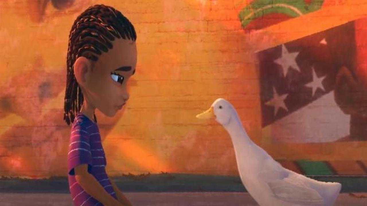 Young African American male speaking with the Aflac duck.