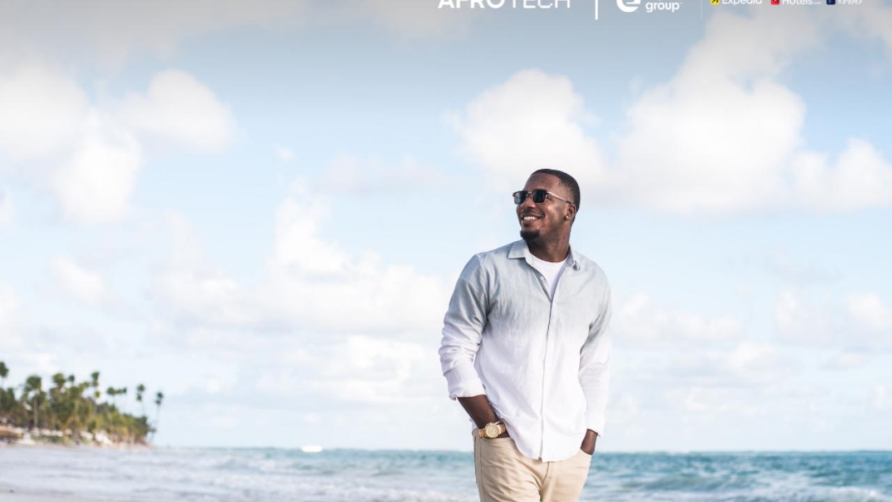 Will Cleveland smiling on a wavy beach.