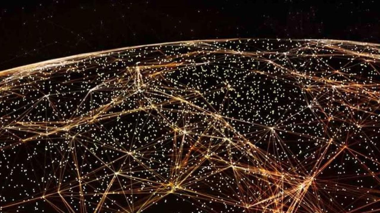 Aerial view of a dark globe in space. Golden lights and lines connecting them covering the surface.