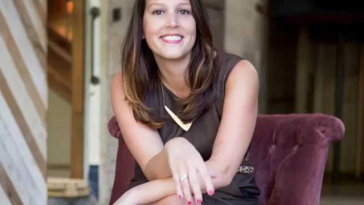 Angela Baker seated.