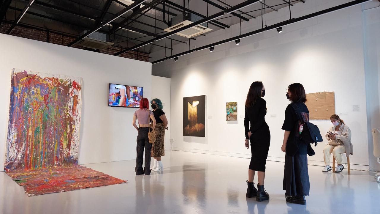 an art gallery with attendees