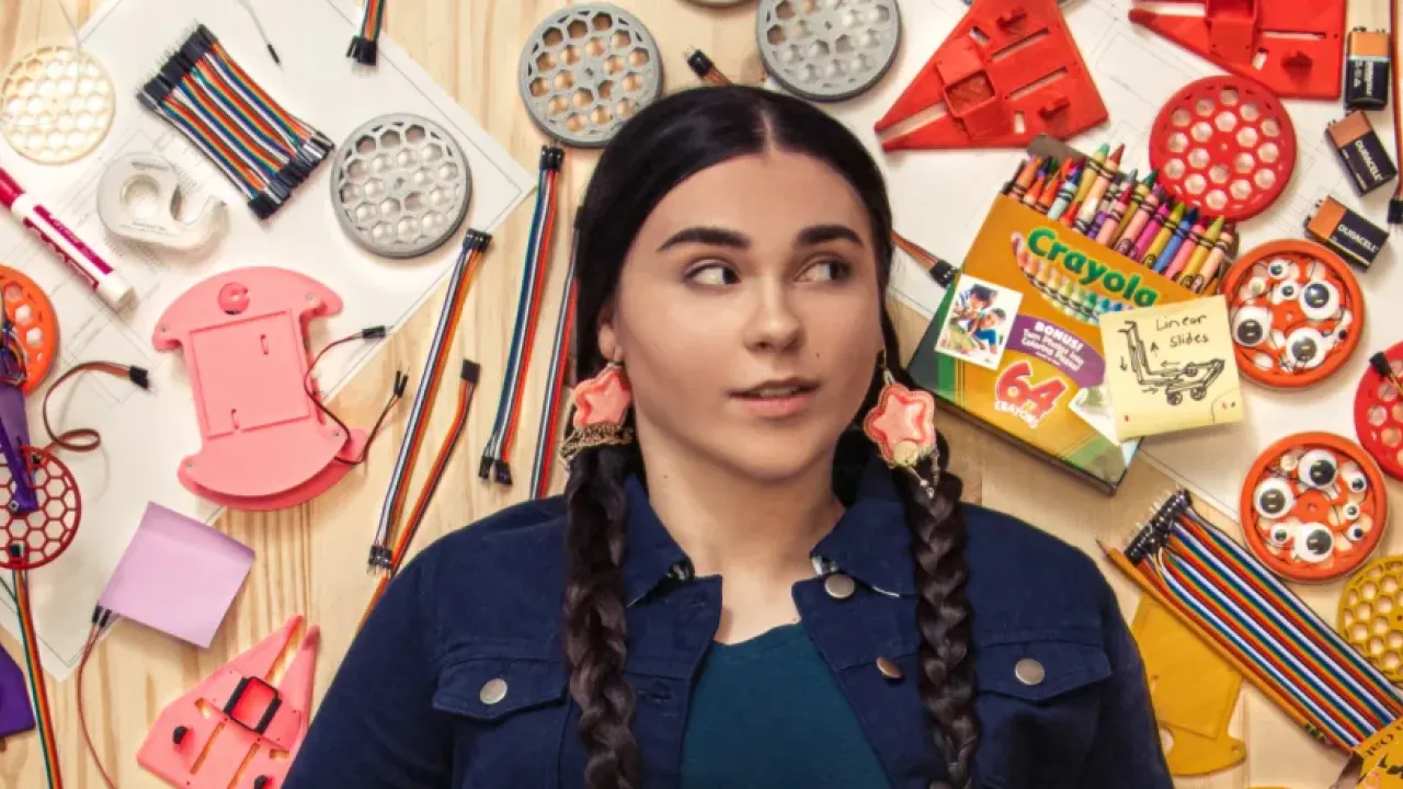 Danielle Boyer laid down surrounded by craft supplies