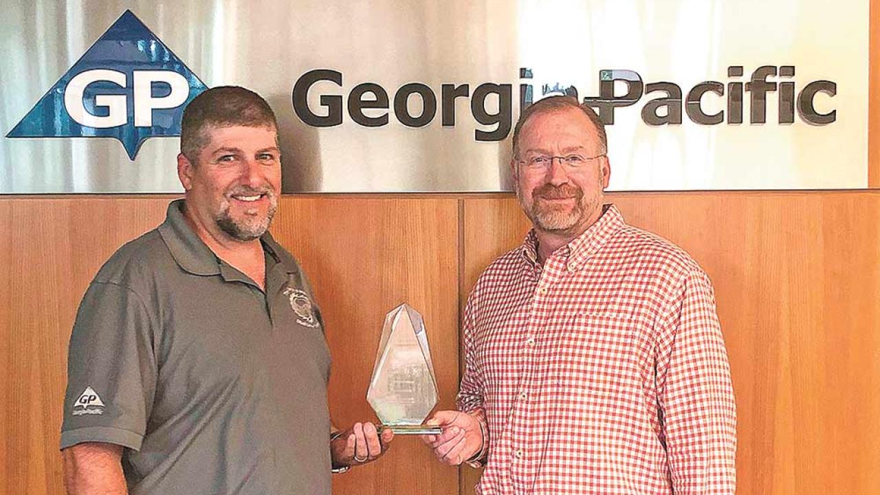 Danny Wright, Diboll Lumber Plant Manager; and Pat Aldred, Vice-President of Composite Panels with award