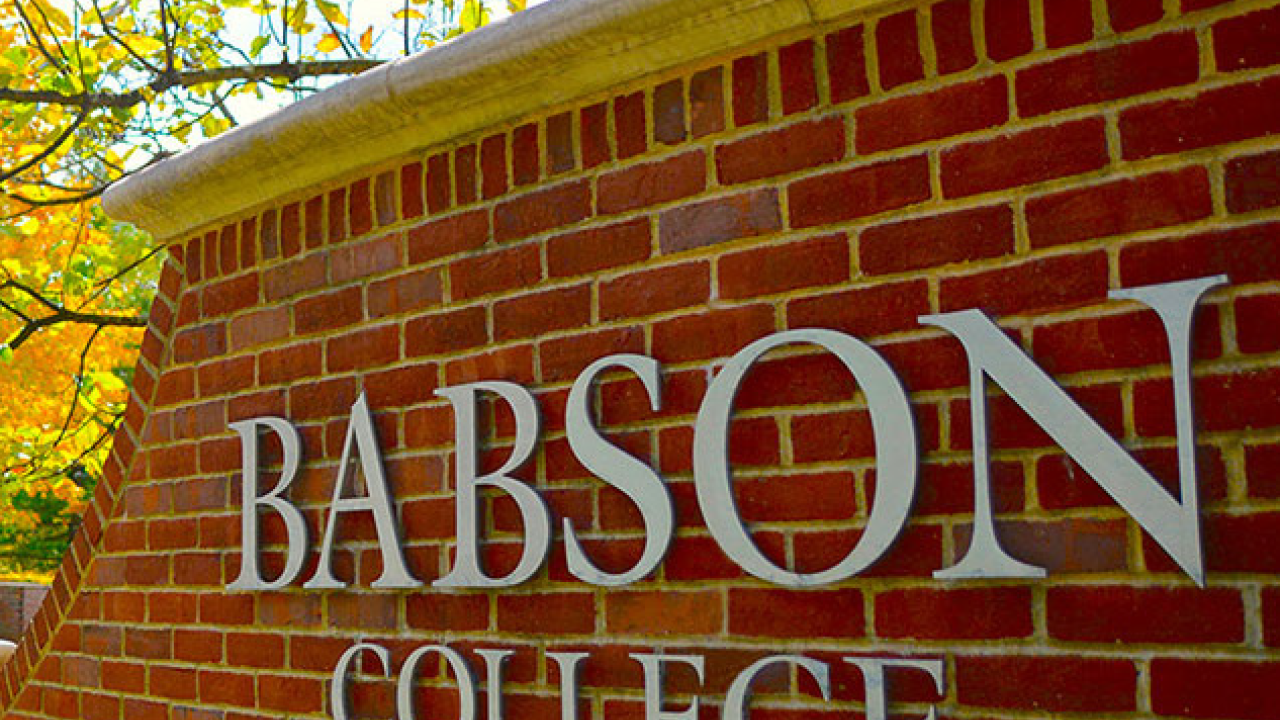 a brick exterior wall with "Babson College" lettering on it