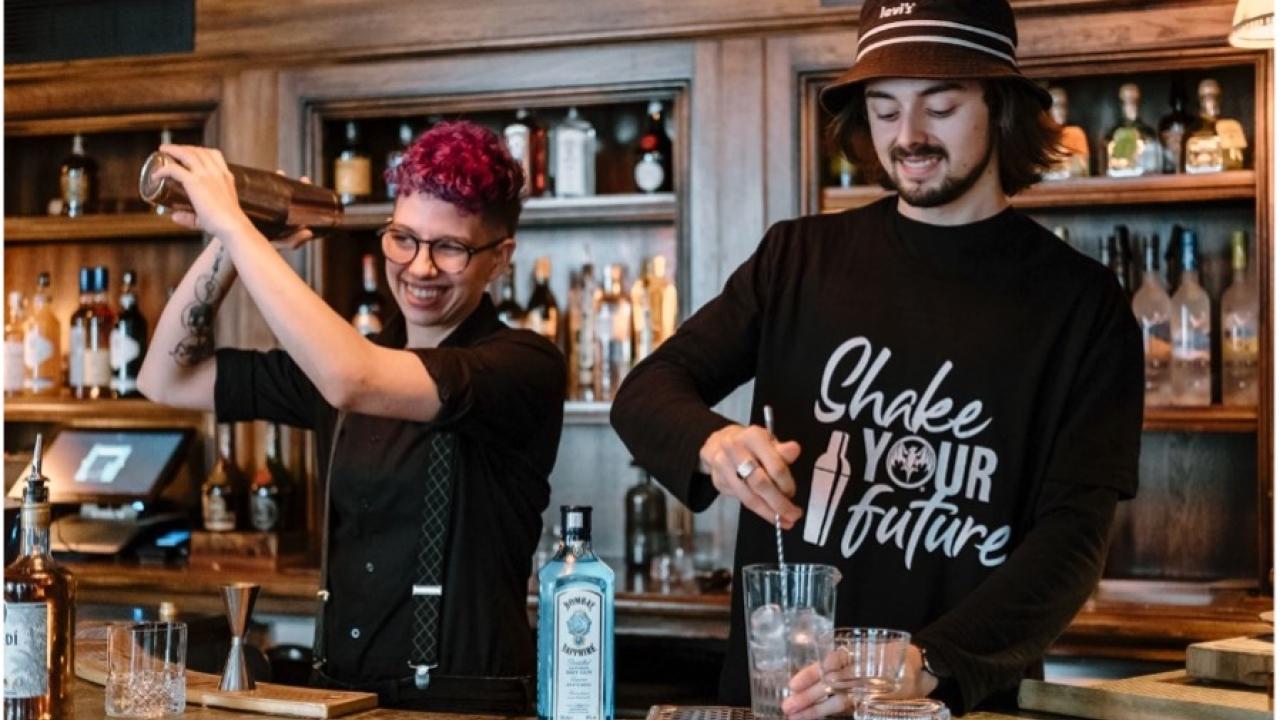 two bartenders practicing