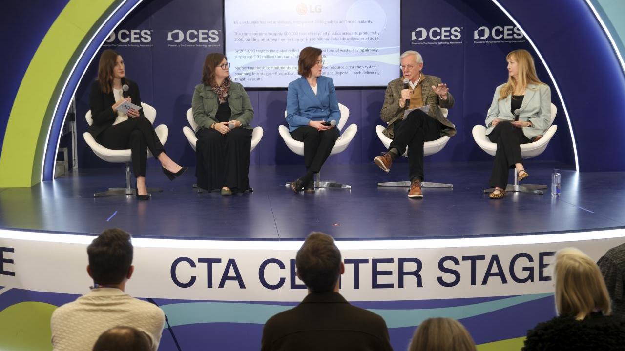 panel of people sitting on a stage