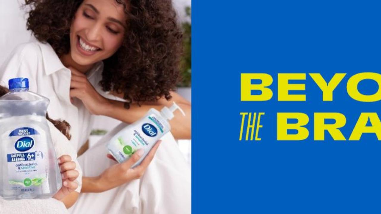 An adult and child holding Dial soap, with text "Beyond the Brand"