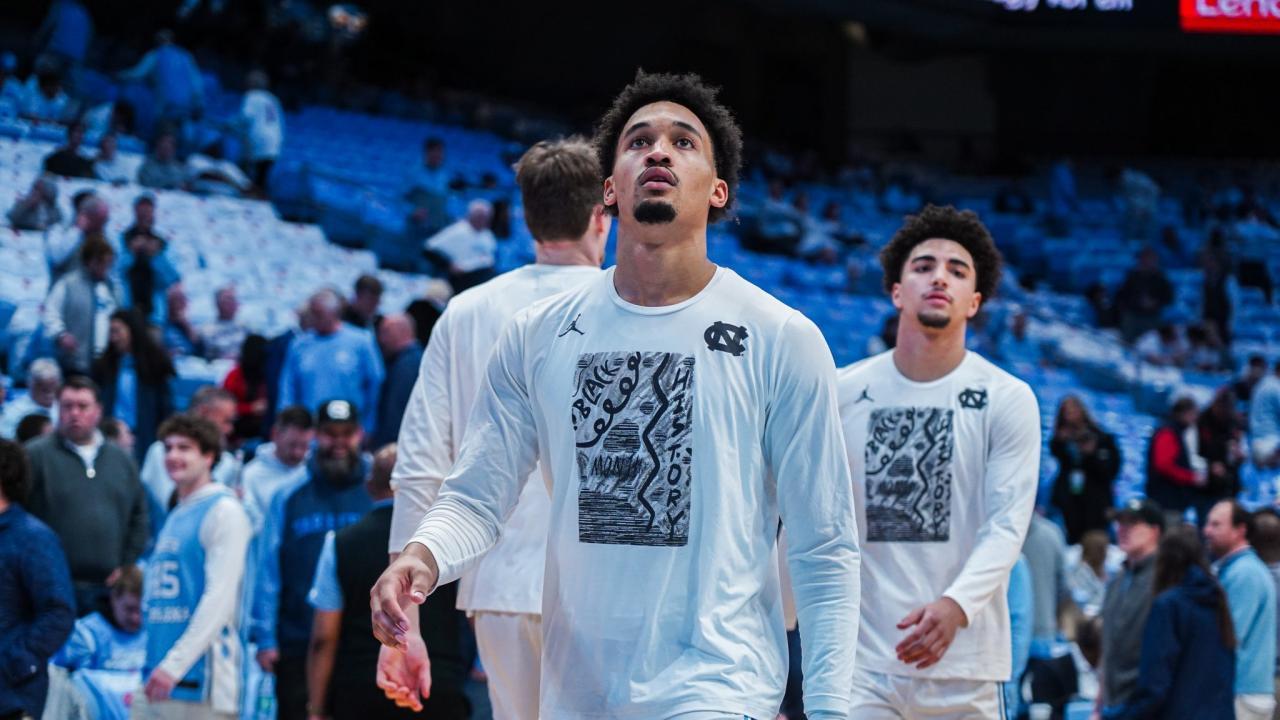 UNC basketball players wearing the student-created t-shirt design 