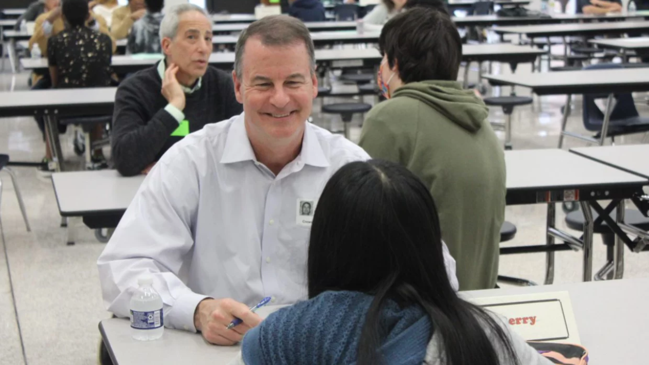 GP employee Bob Berry talking with a student