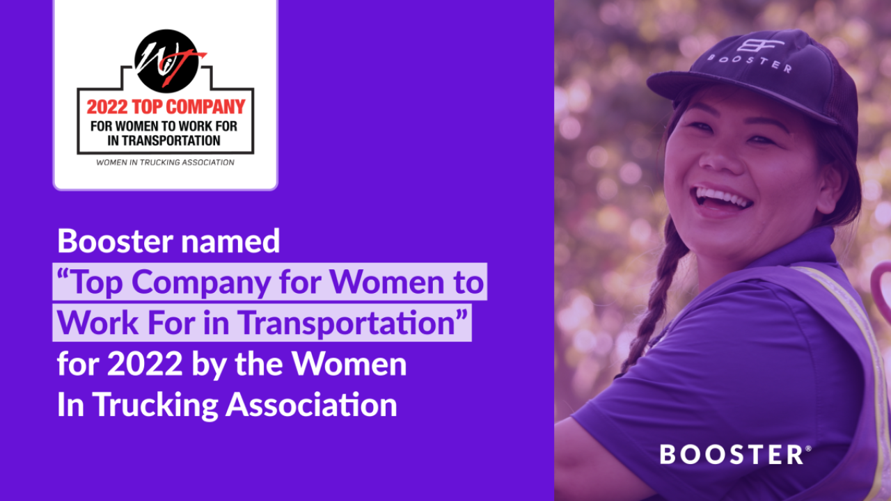 Against a purple background, the words "Booster named 'Top Company for Women to Work For in Transportation' for 2022 by the Women in Trucking Association." To the right, a woman in a Booster service professional uniform smiles at the camera. 