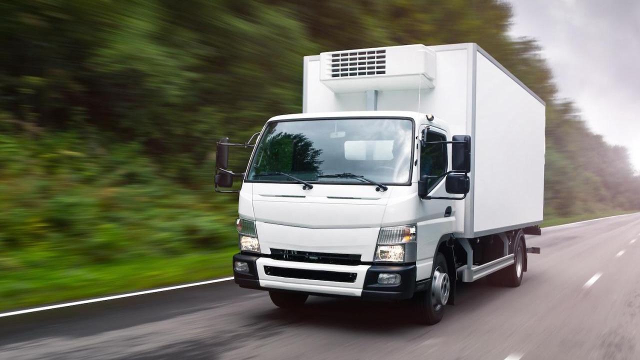 A large vehicle driving down the road
