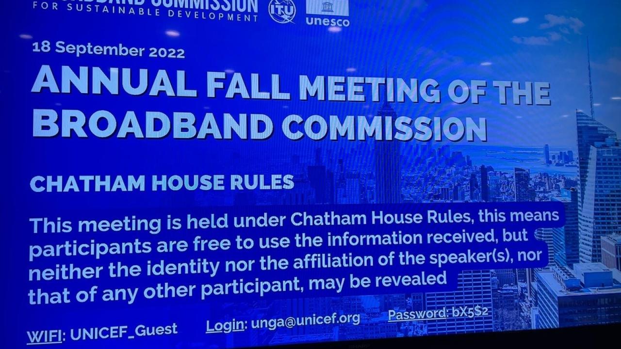 Presentation on a large screen "Annual fall meeting of the broadband commission" Chatham house rules.