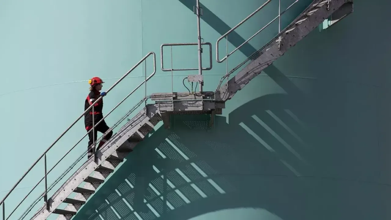 person walking up steps outside a building