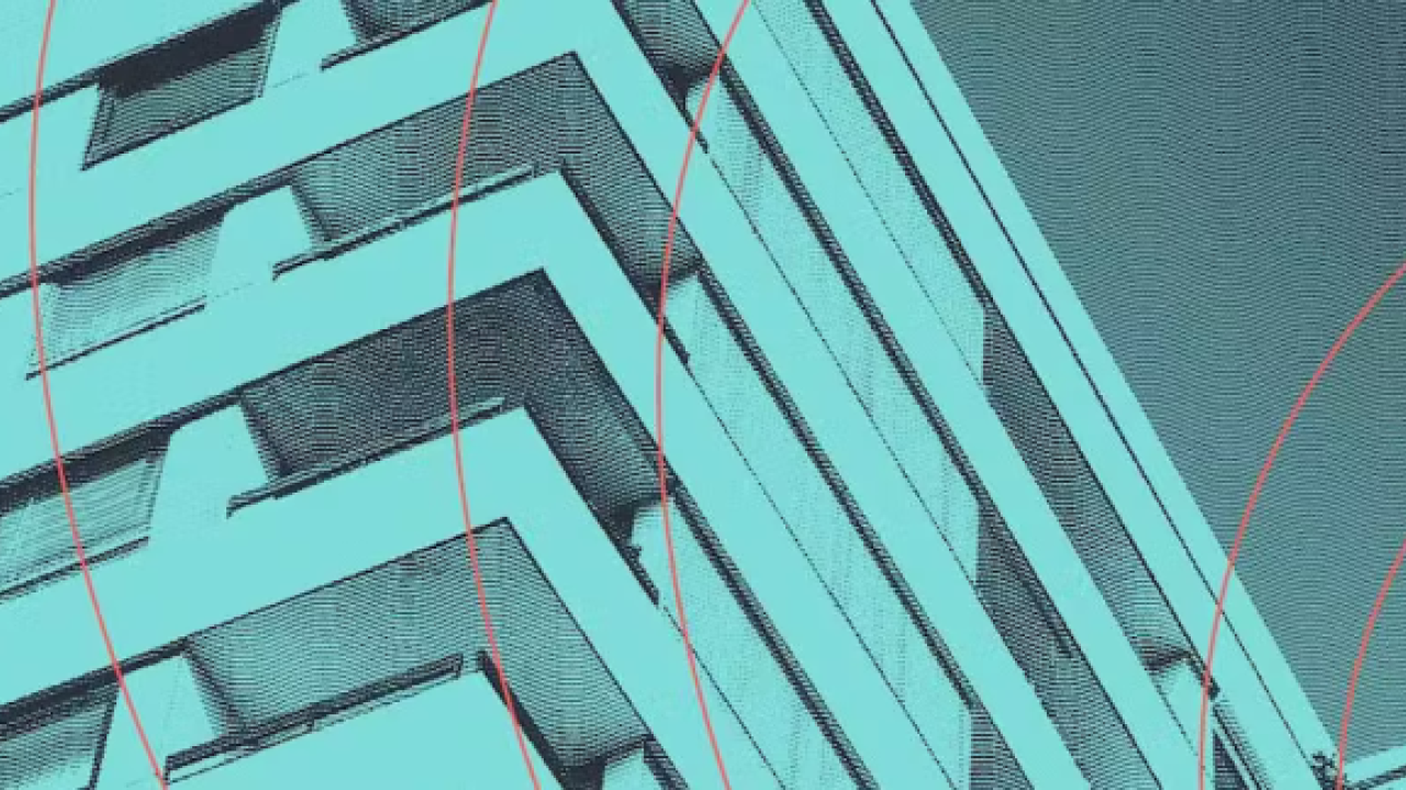 The side of a tall building, a green tint over the whole image.