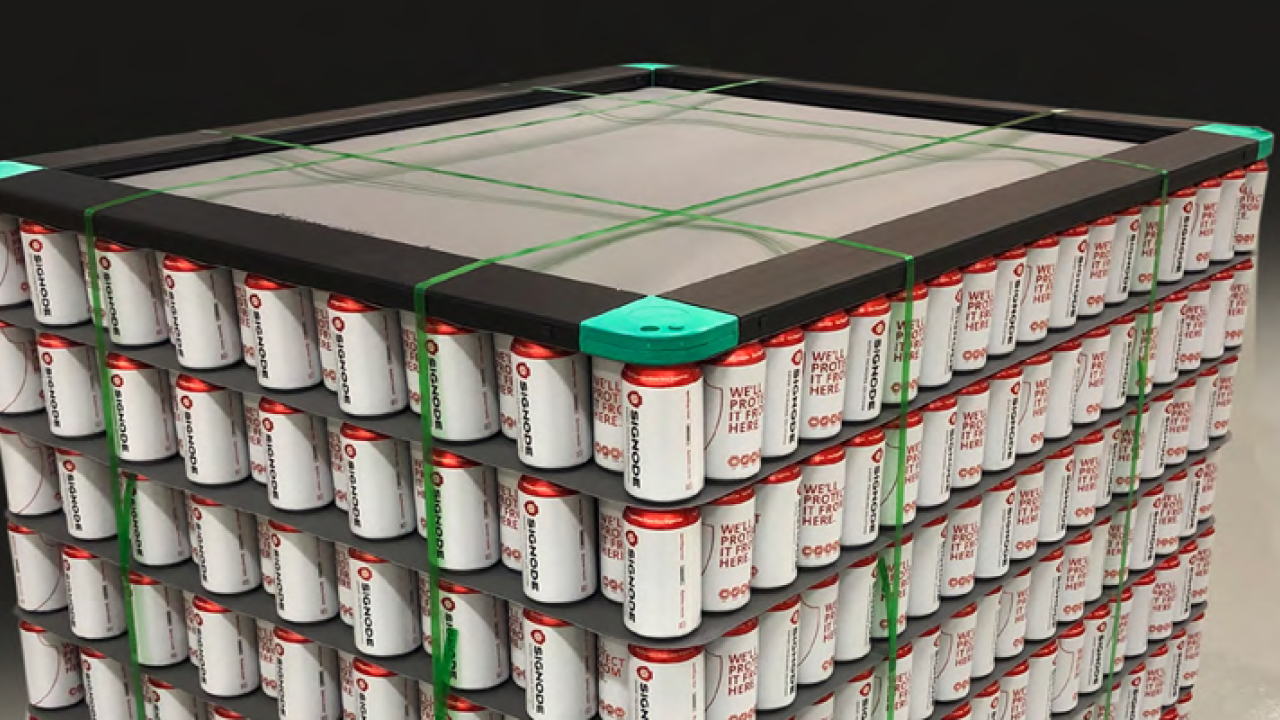 A pallet of aluminum cans strapped together