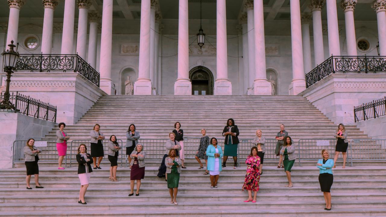 women standing on the steps of Capital Hill