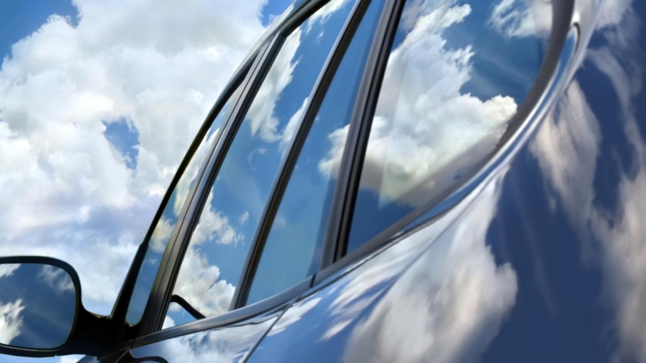 car with blue sky and clouds