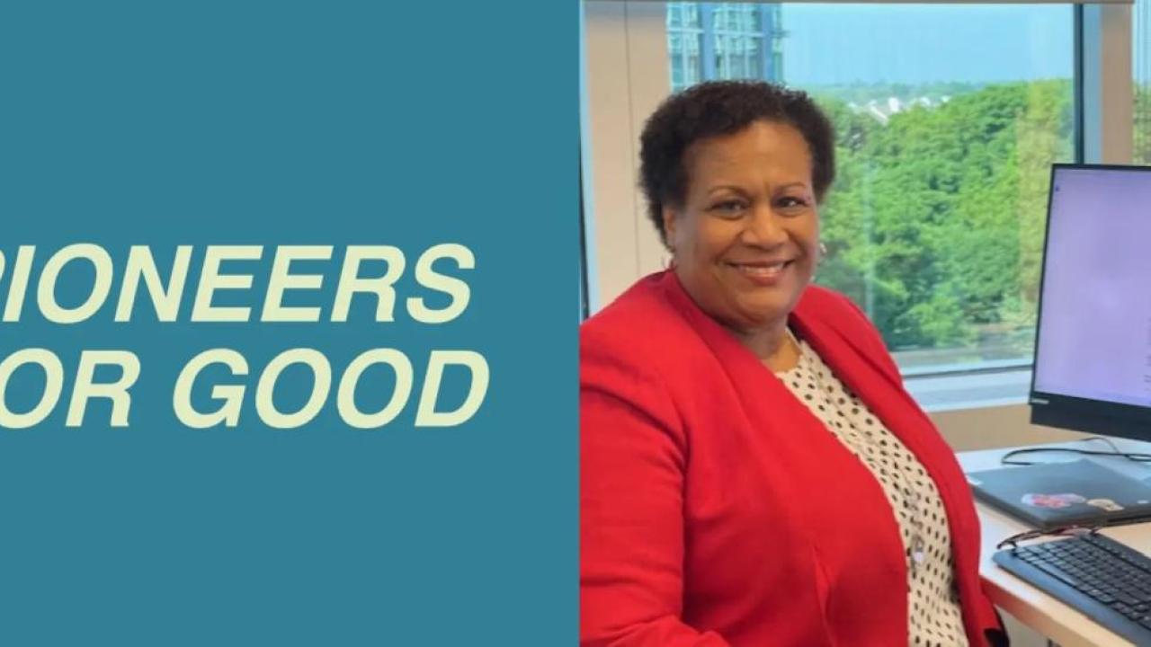 Pioneers for good | Carita Hughes in a red jacket, smiling