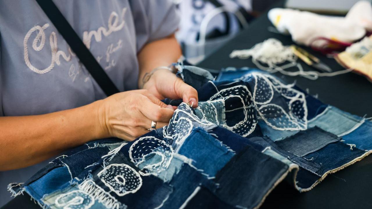 Women in blue stitching denim