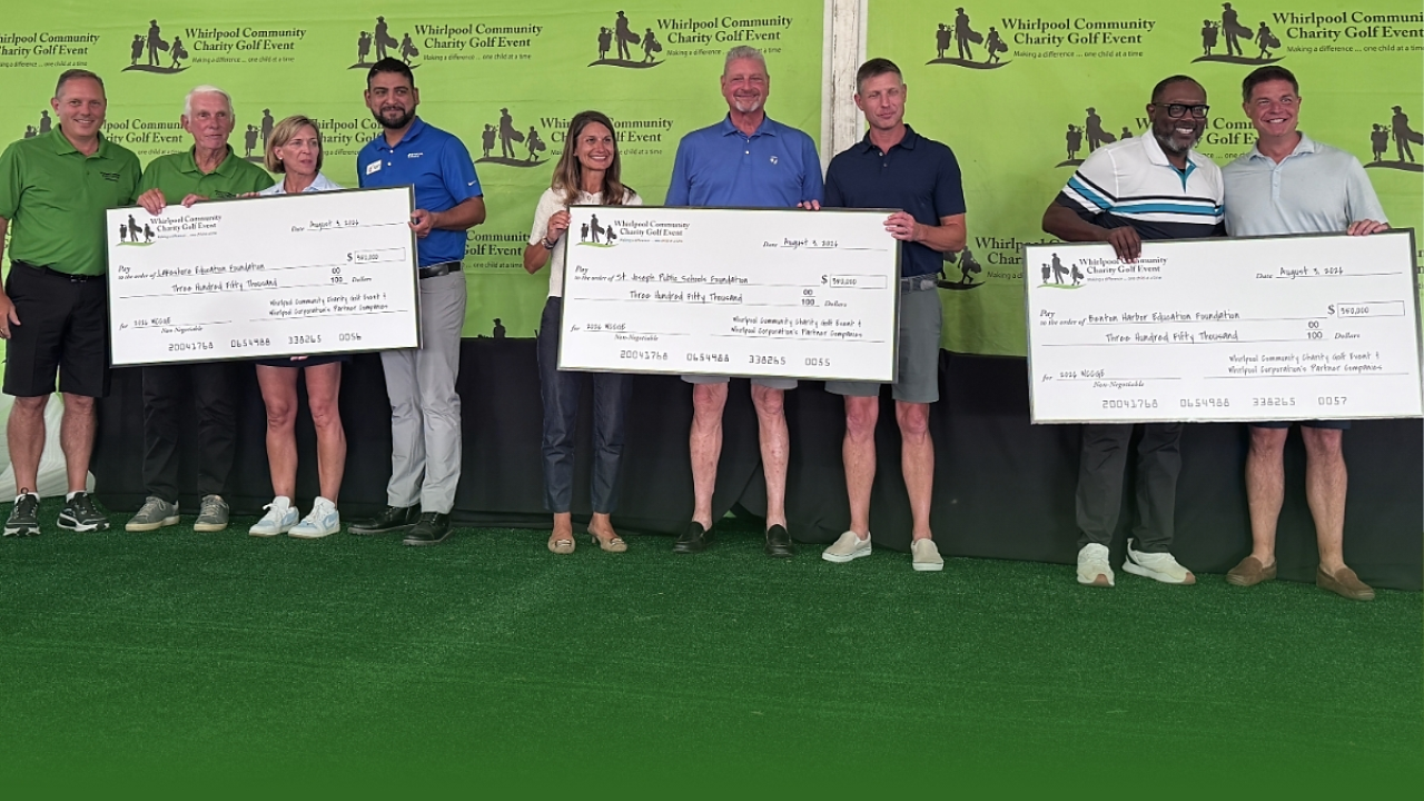 people holding up charity checks