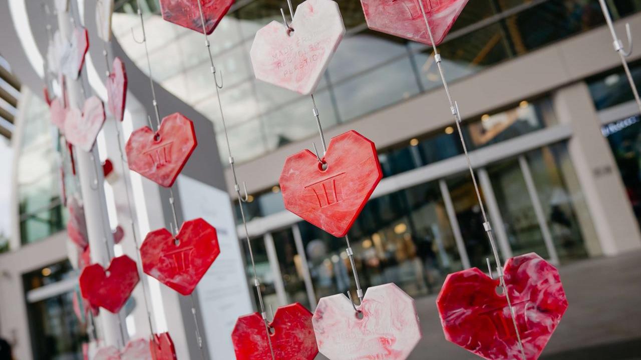 Hearts hanging on a grid outside a building