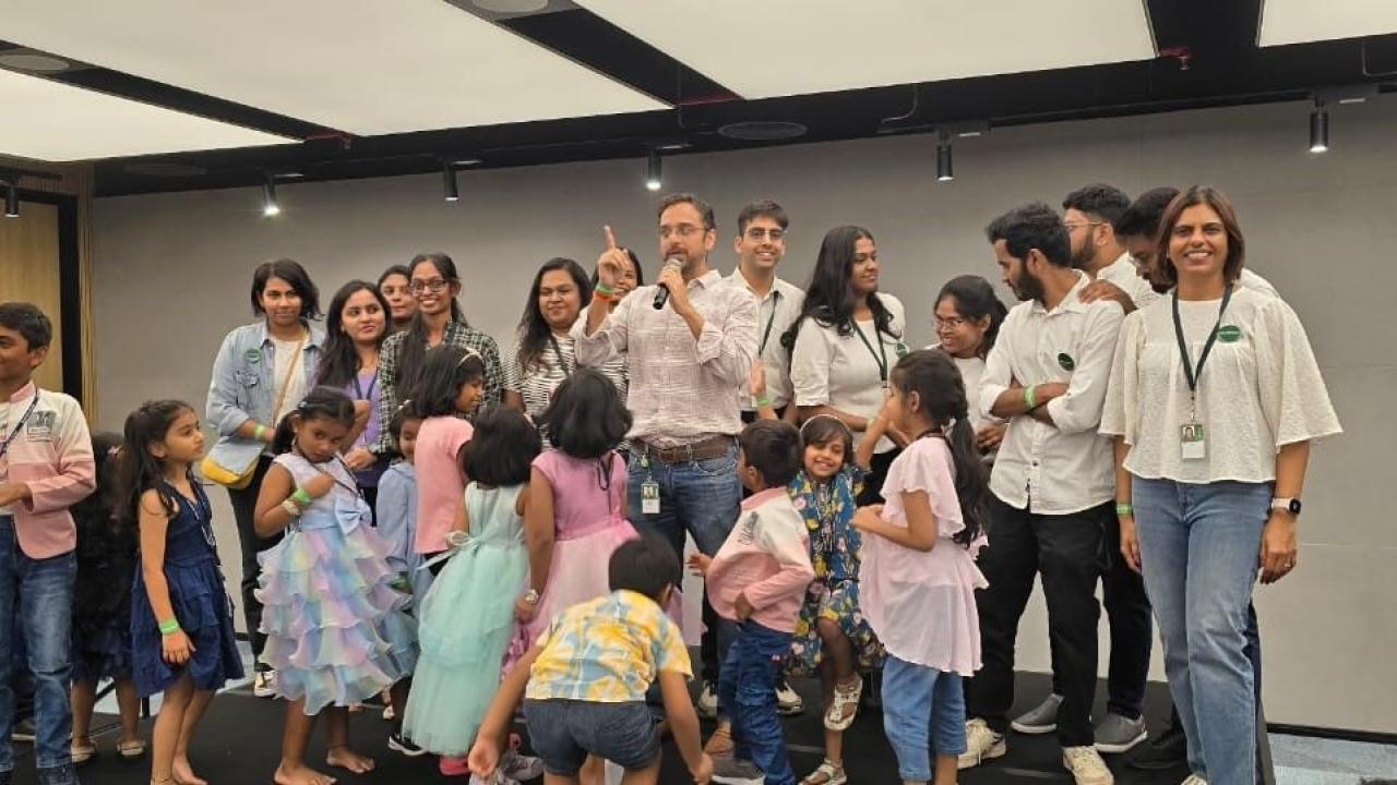 Employees and their children in an office