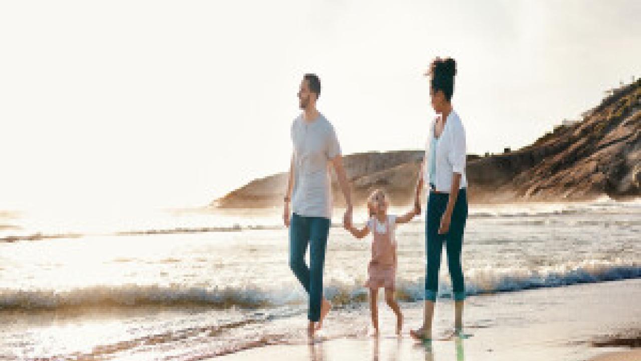 Family walking on the beach