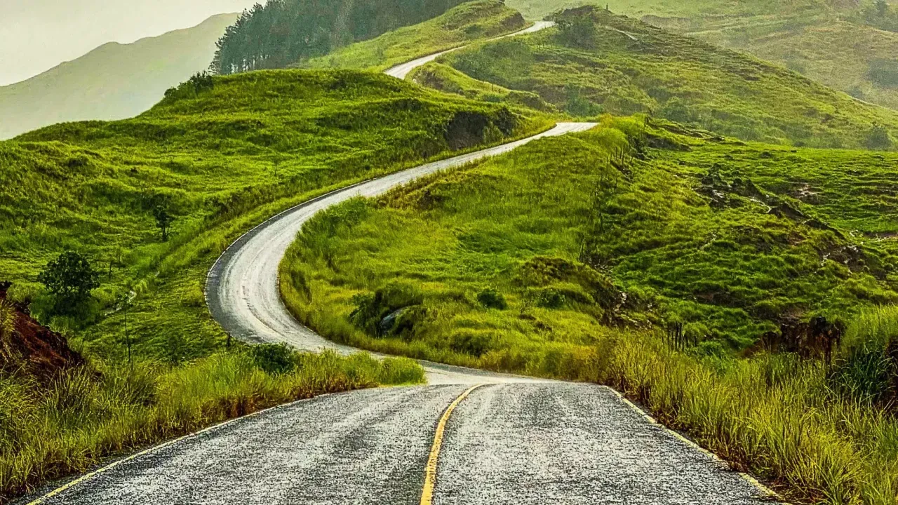 A winding road up a hilly landscape