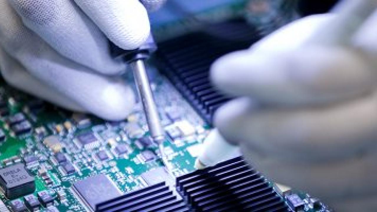 person working on circuit board