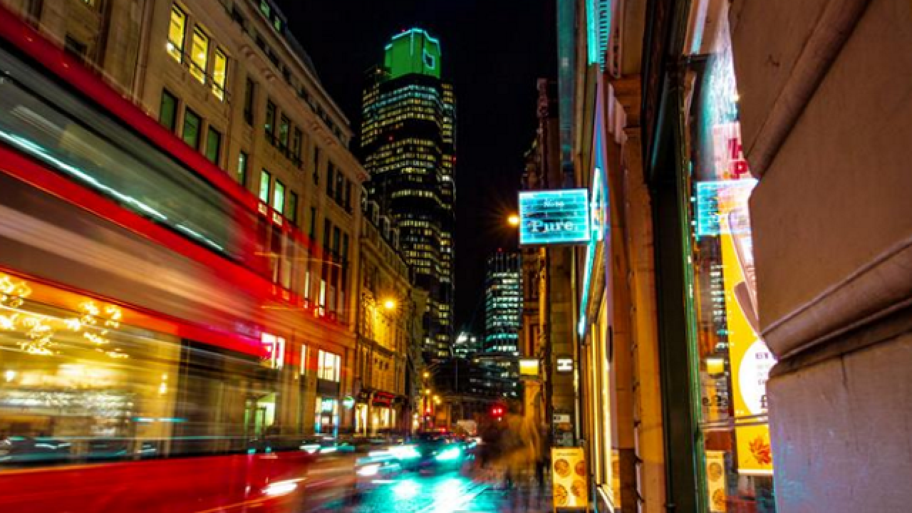 Photo of a city with a blurred image of  bus