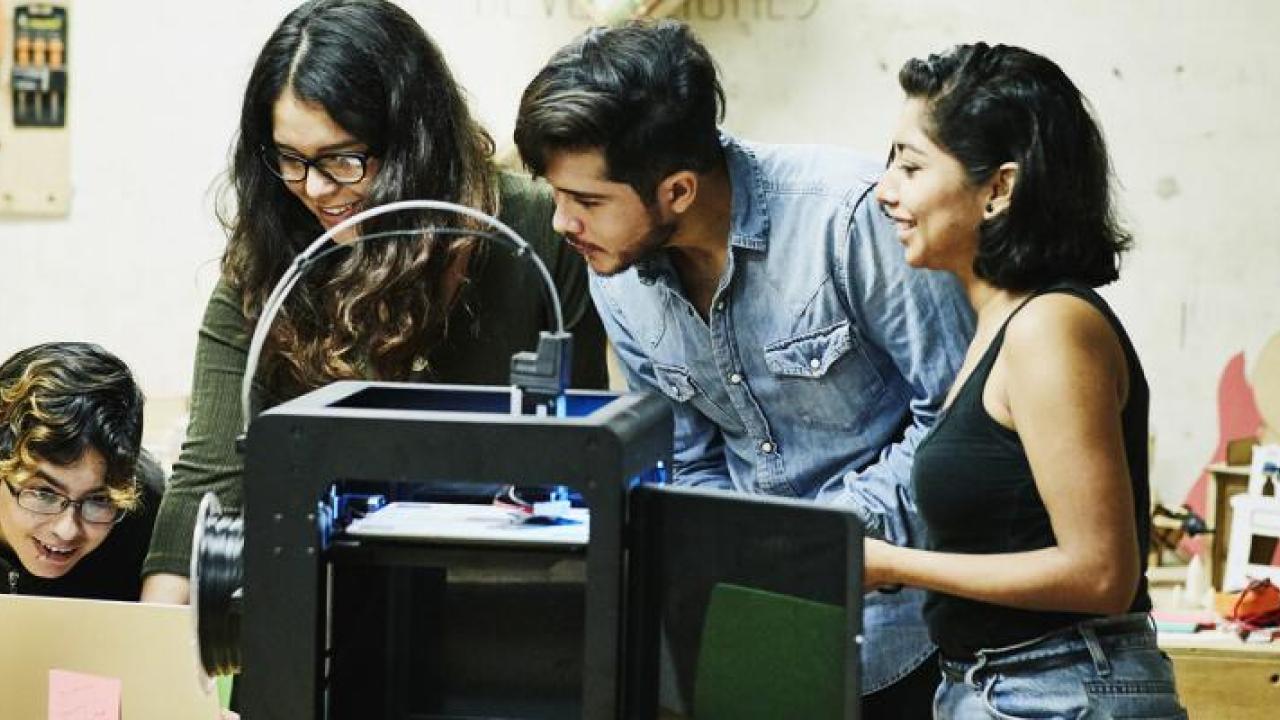Young people working on a scientific project together