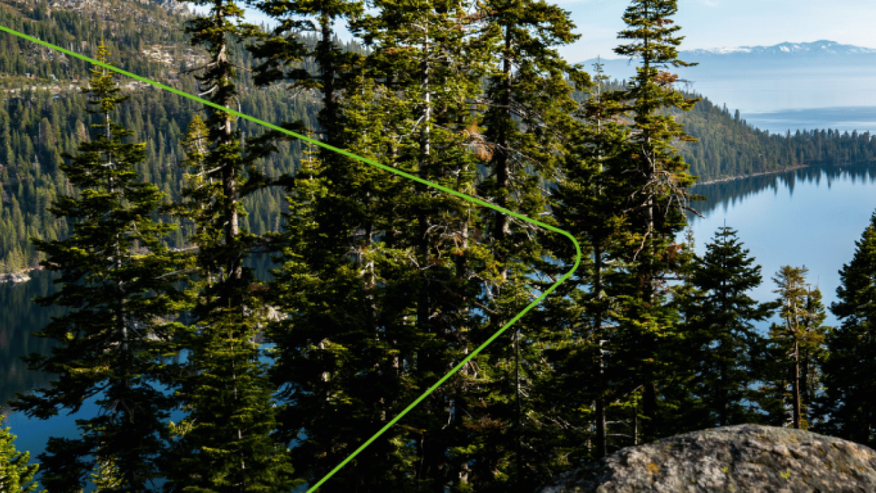 Panoramic view of a forested, hilly coastline.