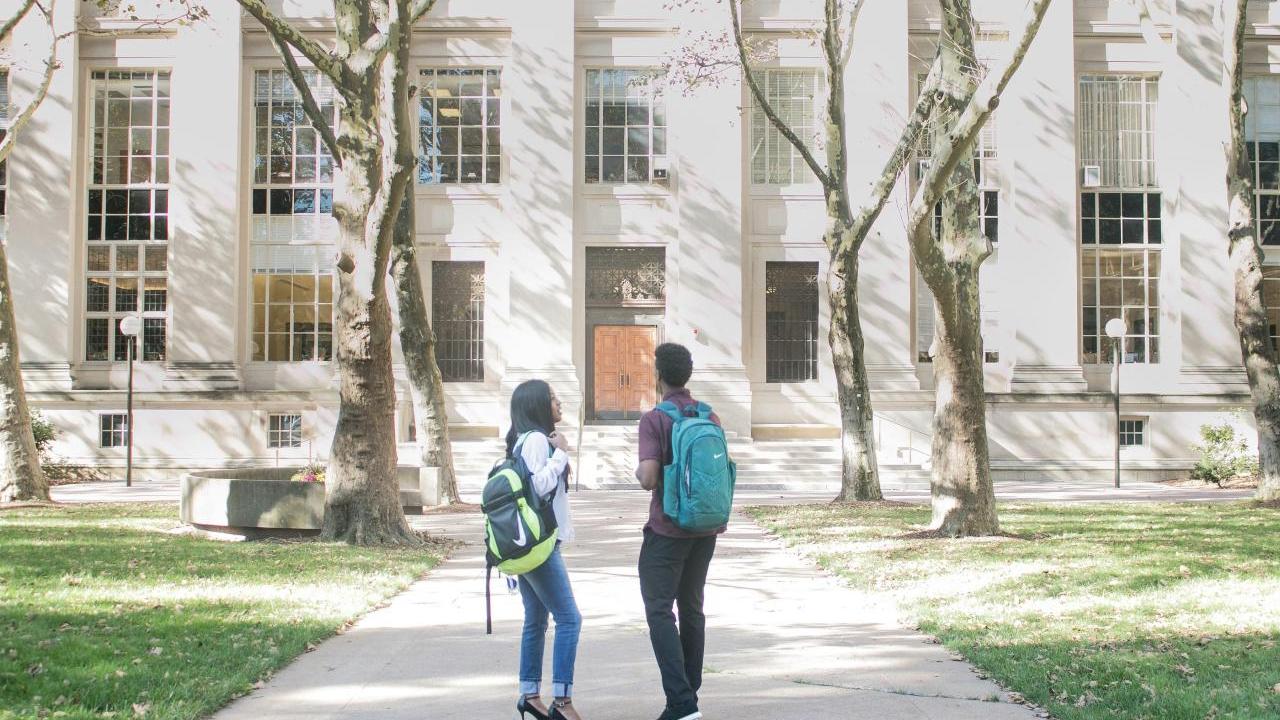 people walking on a college campus