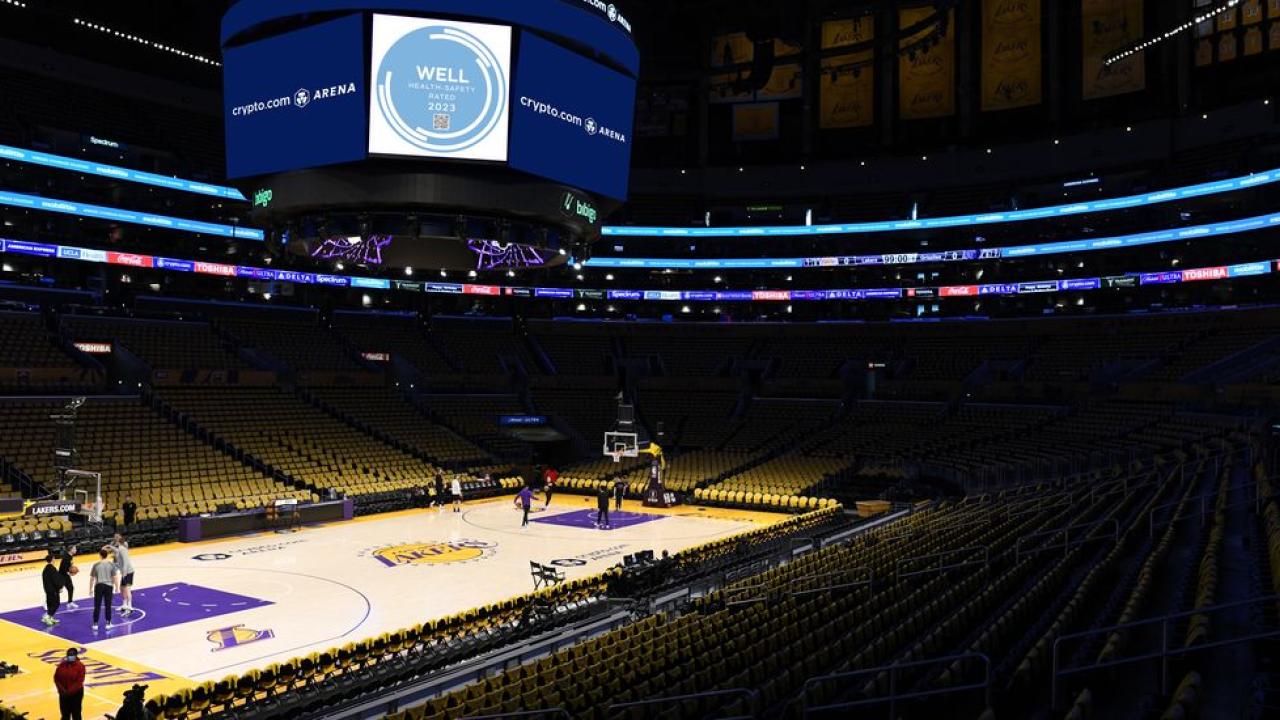 Inside the Crypto.com arena, a basketball court and stadium seating.