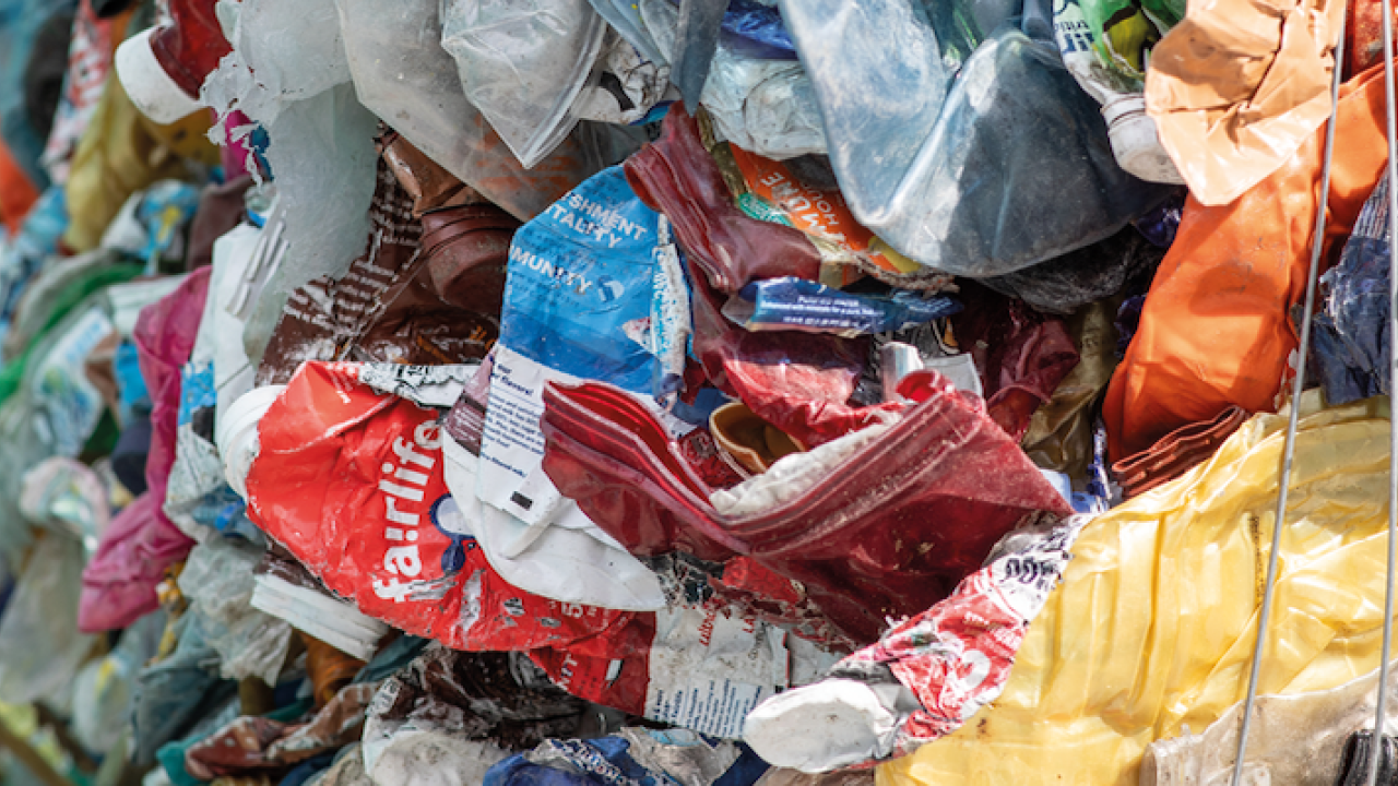 Plastic waste shown in the process of being sorted for recycling.